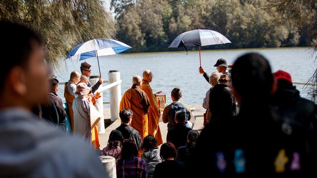 A buddhist ceremony took place at Shearer Park in Lansvale after police recovered the trio’sbodies. Picture: NewsWire / Nikki Short