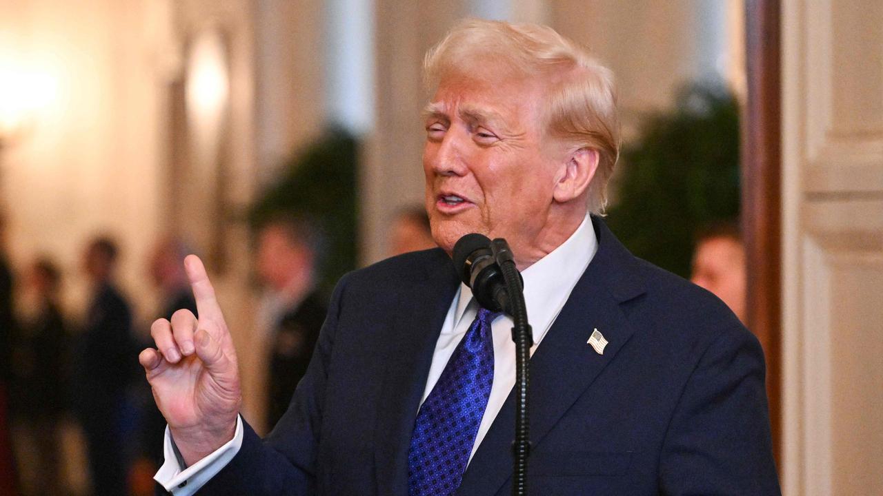 US President Donald Trump speaks before signing the Laken Riley Act in the East Room of the White House in Washington, DC, January 29, 2025. The Laken Riley Act -- which mandates the detention of undocumented immigrants charged with theft-related crimes -- is named for a 22-year-old student murdered by a Venezuelan man with no papers who was wanted for shoplifting. (Photo by ROBERTO SCHMIDT / AFP)