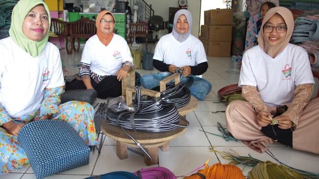 A group of weavers in Java, Indonesia, who make the bags, using traditional weaving techniques. Picture: Supplied