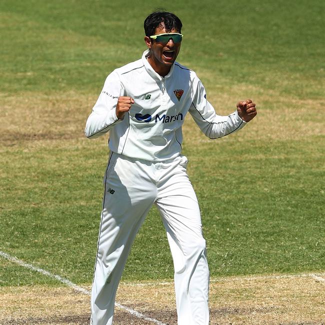 SYDNEY, AUSTRALIA - FEBRUARY 18: Nivethan Radhakrishnan of the Tigers celebrates taking the wicket of Peter Nevill of the Blues during day one of the Sheffield Shield match between New South Wales and Tasmania at Sydney Cricket Ground, on February 18, 2022, in Sydney, Australia. (Photo by Mark Metcalfe/Getty Images)