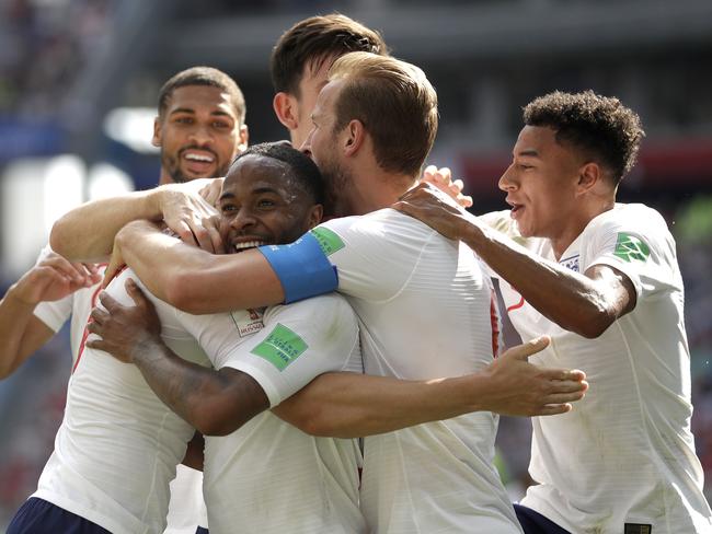 England's John Stones is congratulated by teammates after scoring his team's fourth goal. Pic: AP