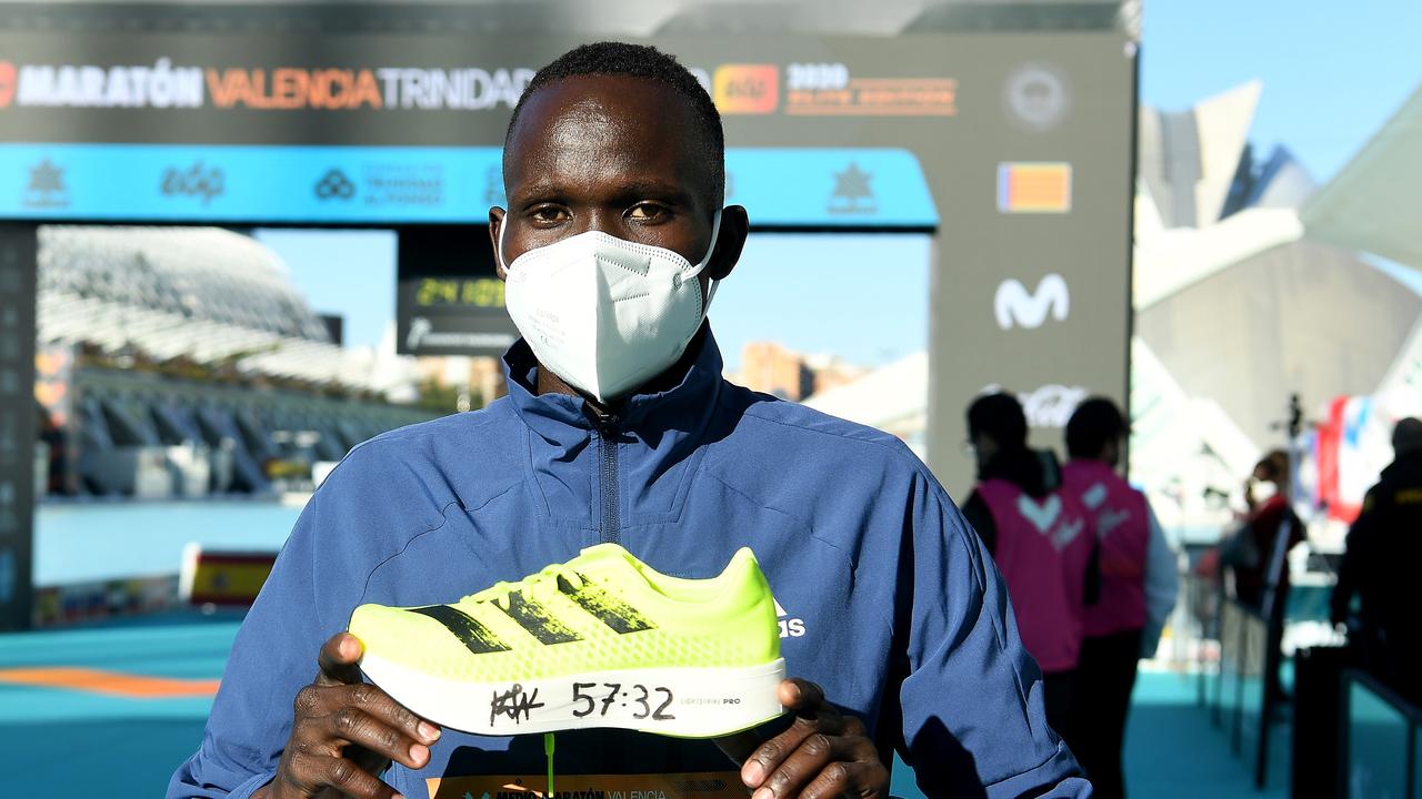 Kibiwott Kandie of Kenya poses with the Adidas adizero adios pro after breaking the Men’s Half Marathon World Record.