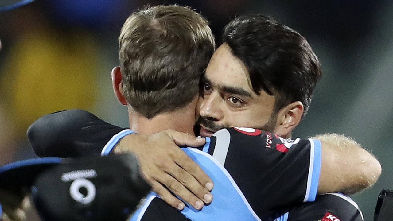 Rashid Khan gets a hug from captain Colin Ingram after Adelaide’s win over Sydney on New Year’s Eve. Picture: Sarah Reed.