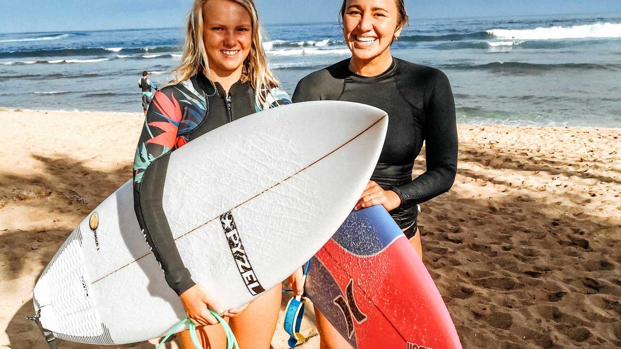 Amarnie Barber with three-time world champion Carissa Moore. Picture: Craig Barber