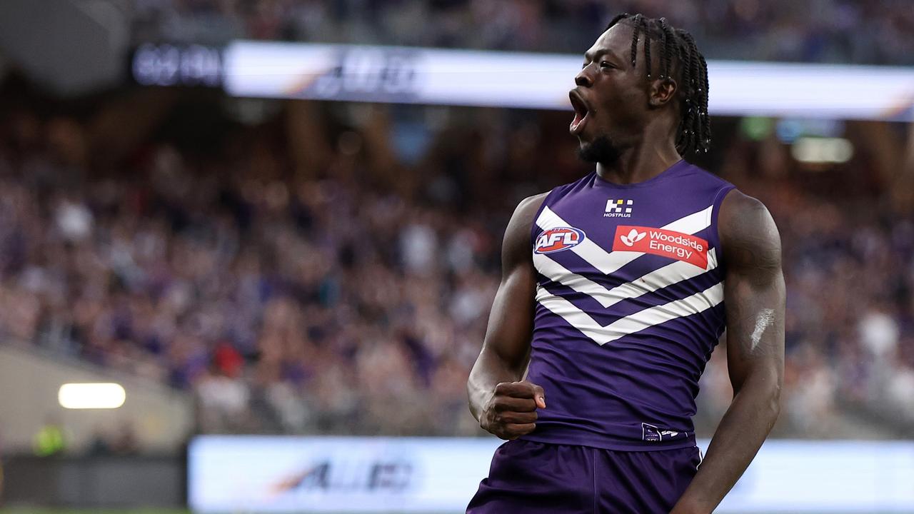 PERTH, AUSTRALIA - MARCH 17: Michael Frederick of the Dockers celebrates after scoring a goal during the 2024 AFL Round 01 match between the Fremantle Dockers and the Brisbane Lions at Optus Stadium on March 17, 2024 in Perth, Australia. (Photo by Will Russell/AFL Photos via Getty Images)