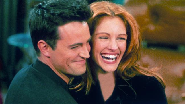 Matthew Perry and Julia Roberts hug each other on the set of Friends. Picture: Liaison.