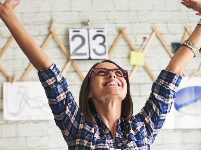 A woman with her hand in the air Celebrating Success.  ipad generic