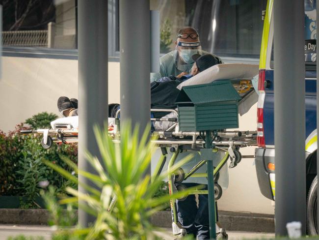 Residents are removed from the aged care centre St Basils Greek Orthodox. Picture: Jason Edwards