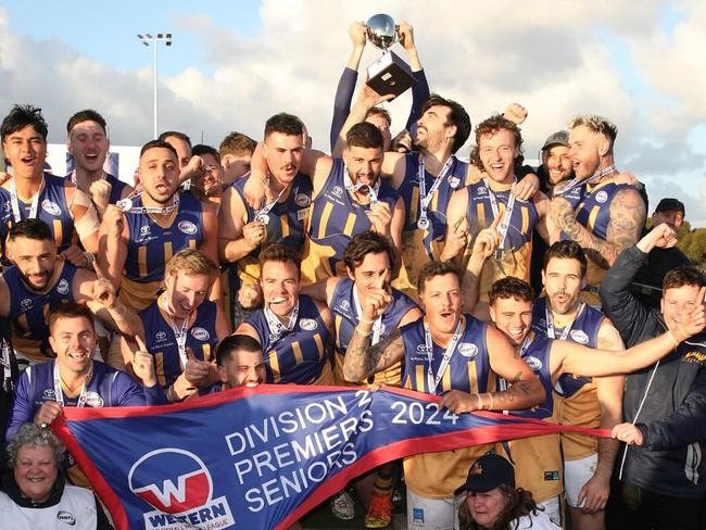 Sunshine celebrate their premiership. Photo: WFNL.