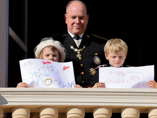 Questions were raised after the pair’s two children, Jacques and Gabriella, held messages for their mum on the Monaco palace balcony. Picture: Valery HACHE / AFP