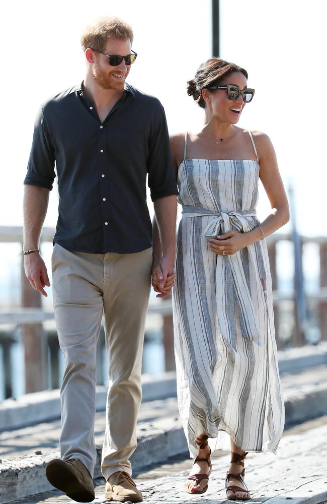 Prince Harry and pregnant wife Meghan Markle walking with along Kingfisher Bay pier, Fraser Island. Photographer: Liam Kidston