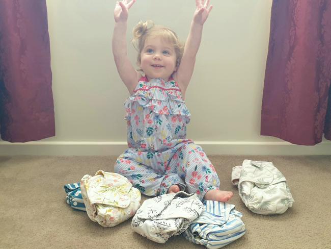 Amy uses reusable nappies on her daughter, Daisy. Picture: Supplied.