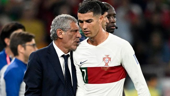 Portugal coach Fernando Santos greets Cristiano Ronaldo as he leaves the pitch against South Korea. Picture: AFP