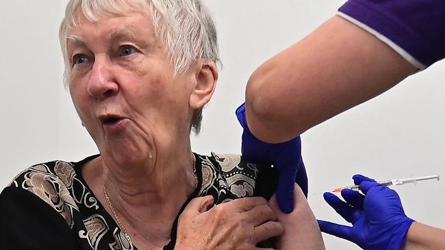 Jane Malysiak, 84, becomes the first person in Australia to receive a dose of the Pfizer/BioNTech Covid-19 vaccine in Sydney. Picture: AFP