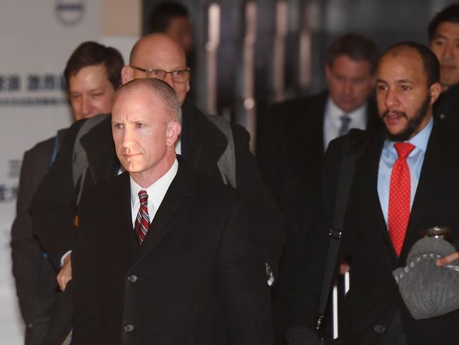 Deputy US Trade Representative Jeffrey Gerrish (L) leaves a hotel with his negotiation team for the second day of talks in Beijing on January 8, 2019. - The US delegation in Beijing includes officials from the Treasury, Commerce, Agriculture and Energy departments. The talks come a month after US President Donald Trump and his Chinese counterpart Xi Jinping agreed to suspend a planned tariff hike for three months to give negotiators space to reach an agreement and end a dispute that has roiled world markets. (Photo by Greg Baker / AFP)