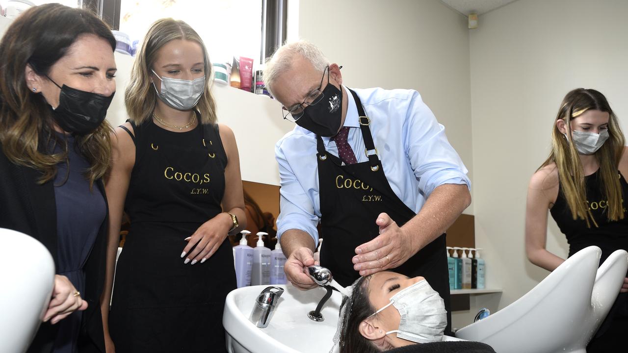 First-year apprentice Courtnie Trotter was on the receiving end of Mr Morrison’s hair-washing skills. Picture: NCA NewsWire / Andrew Henshaw