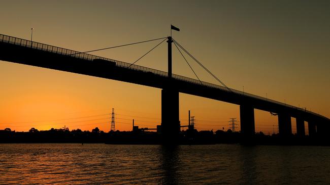 The sun sets behind the West Gate Bridge, Melbourne, Victoria. Picture: Mark Stewart