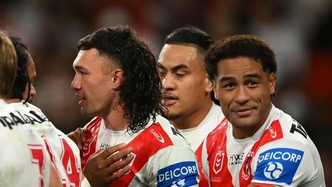 BRISBANE, AUSTRALIA - JULY 13: Dragons celebrate a Jaydn Su'A try during the round 19 NRL match between Brisbane Broncos and St George Illawarra Dragons at Suncorp Stadium, on July 13, 2024, in Brisbane, Australia. (Photo by Albert Perez/Getty Images)