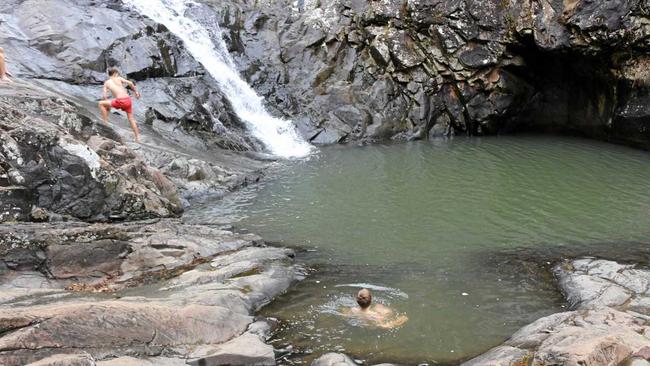 Swimming in the icy cold water at Cedar Creek Falls at Tamborine Mountain didn't phase her sons. Picture: Kate Bennie