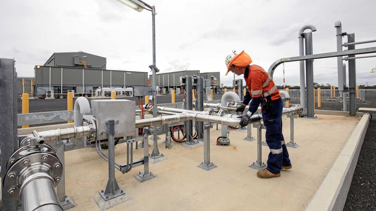PRICE WAR: A plant operator working at one of APLNG's new gas processing facilities.