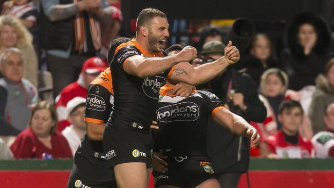 Robbie Farah celebrates a try for the Wests Tigers.