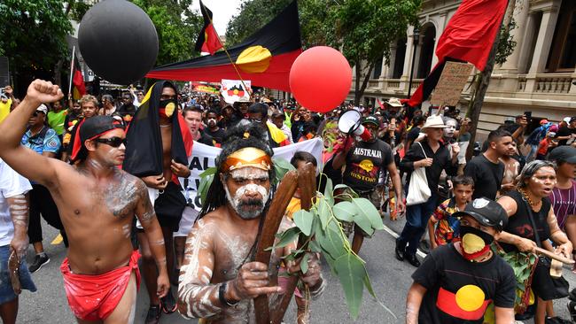 Protestors are seen during the Invasion Day rally in Brisbane. Picture: AAP