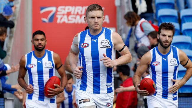 Jack Ziebell of the Kangaroos leads his team on to the ground. Photo by Dylan Burns/AFL Photos via Getty Images.