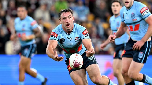 BRISBANE, AUSTRALIA - JUNE 21: Reece Robson of New South Wales passes the ball during game two of the State of Origin series between the Queensland Maroons and the New South Wales Blues at Suncorp Stadium on June 21, 2023 in Brisbane, Australia. (Photo by Bradley Kanaris/Getty Images)