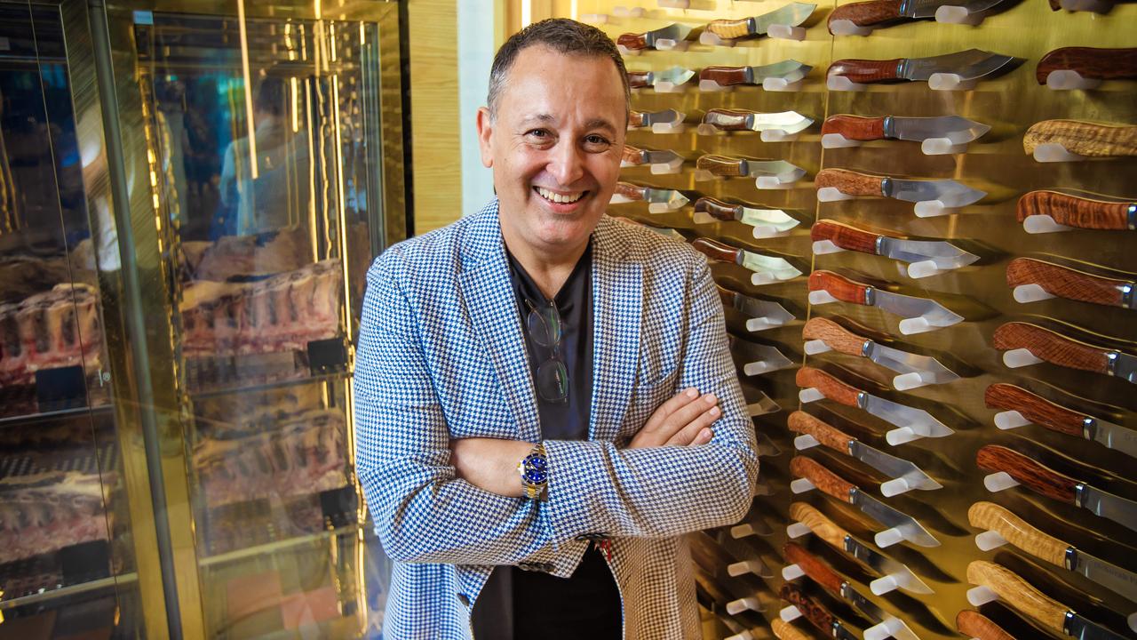 John Gambaro next to the knife ambassador display at his new restaurant Black Hide Steak and Seafood in Queens Wharf. Picture: Nigel Hallett