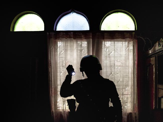 Philippine security forces in Marawi City inspect empty houses and a hospital for guns and ammunition which the enemy might use against them. Picture: Jes Aznar/Getty Images