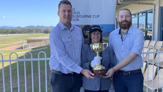 Coffs Harbour Racing Club CEO Tim Saladine, 2001 Melbourne Cup winning trainer Sheila Laxon (Ethereal) and club licensee and events manager Joel Roberts with the Melbourne Cup. Picture: Chris Knight