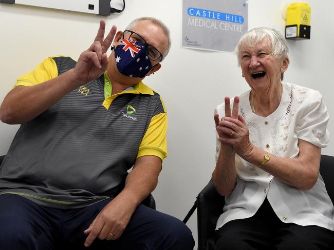 SYDNEY, AUSTRALIA - NewsWire Photos MARCH, 14, 2021: Prime Minster Scott Morrison (left) and aged care resident Jane Malysiak gesture after receiving their second and final COVID-19 vaccination shot at the Castle Hill Medical Centre, in Sydney. Picture: NCA NewsWire/Bianca De Marchi