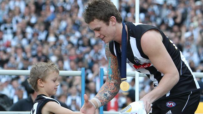 Dayne Beams receives his premiership medal after the 2010 grand final.