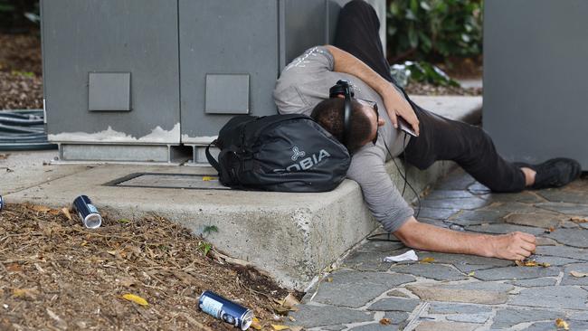 A drunk man sleeps in the Shields Street Mall. Picture: Brendan Radke