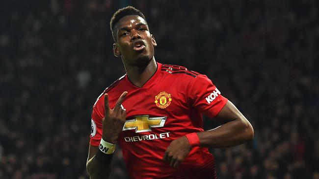 Manchester United's French midfielder Paul Pogba celebrates after scoring his and their second goal during the English Premier League football match between Manchester United and Bournemouth at Old Trafford in Manchester, north west England, on December 30, 2018. (Photo by Paul ELLIS / AFP) / RESTRICTED TO EDITORIAL USE. No use with unauthorized audio, video, data, fixture lists, club/league logos or 'live' services. Online in-match use limited to 120 images. An additional 40 images may be used in extra time. No video emulation. Social media in-match use limited to 120 images. An additional 40 images may be used in extra time. No use in betting publications, games or single club/league/player publications. /