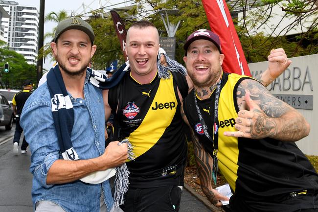 BRISBANE, AUSTRALIA - OCTOBER 24: Fans show their support during the 2020 AFL Grand Final match between the Richmond Tigers and the Geelong Cats at The Gabba on October 24, 2020 in Brisbane, Australia. (Photo by Bradley Kanaris/AFL Photos/via Getty Images)