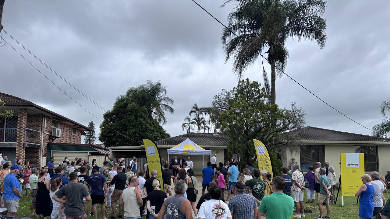 A crowd of more than 150 people turned up to the auction at 23 Robert Stanley Drive, Mount Warren Park