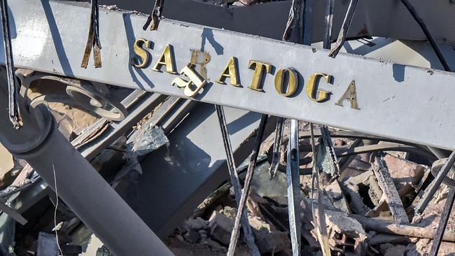 A hotel sign amid the rubble.