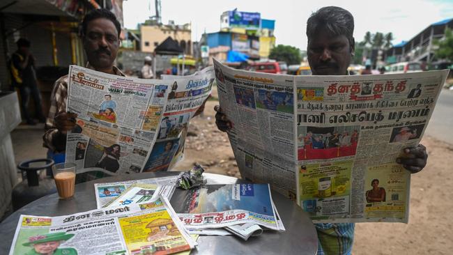 Men at a tea shop in Chennai, India, read news of Elizabeth ll’s death.