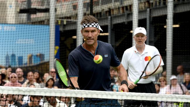 Pat Cash (L) and Jim Courier playing tennis on a court set up in the Bourke Street Mall. Picture: Andrew Henshaw