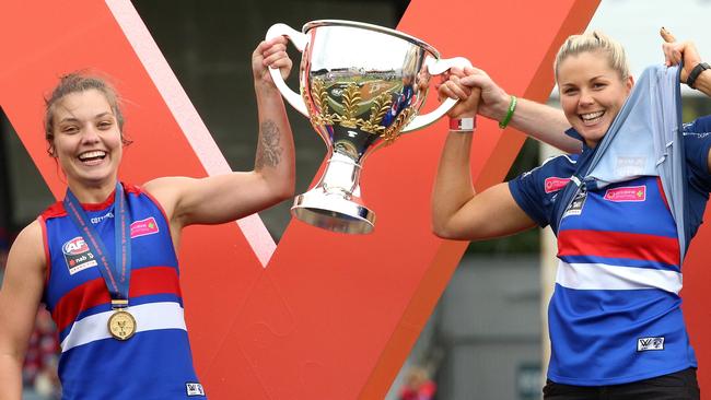 Ellie Blackburn (left) and Katie Brennan celebrate the Western Bulldogs Grand Final win.