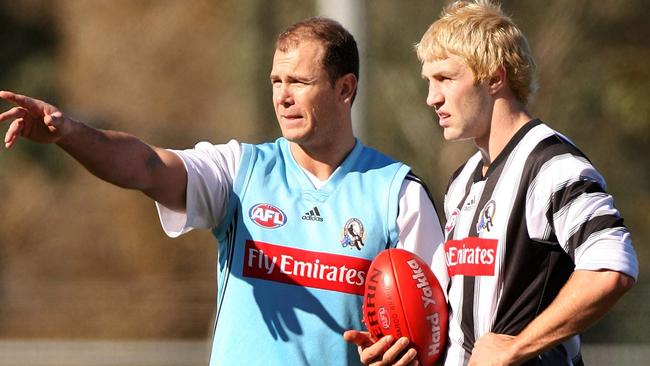 Travis Cloke talking with then-assistant coach Wayne Carey at Collingwood training as a young gun.