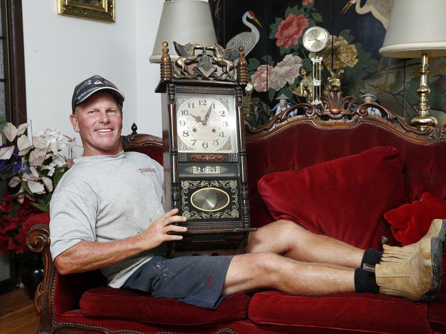 Mark Bennett with one of the clocks and furniture in a Warriewood deceased estate.