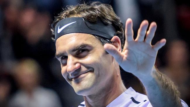 Roger Federer celebrates after winning against Frances Tiafoe at the Swiss Indoors.