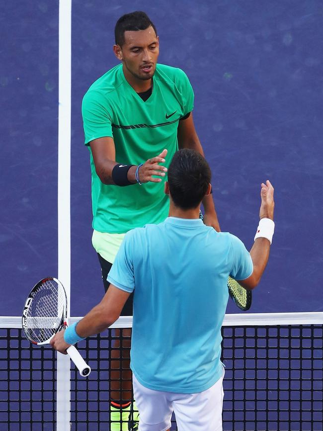 Nick Kyrgios shakes hands after beating Novak Djokovic at Indian Wells.