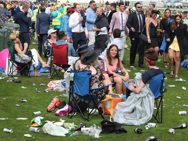 Racegoers are seen at the end of the Lexus Melbourne Cup Day, as part of the Melbourne Cup Carnival, at Flemington Racecourse in Melbourne, Tuesday, November 6, 2018. (AAP Image/Dave Crosling) NO ARCHIVING, EDITORIAL USE ONLY
