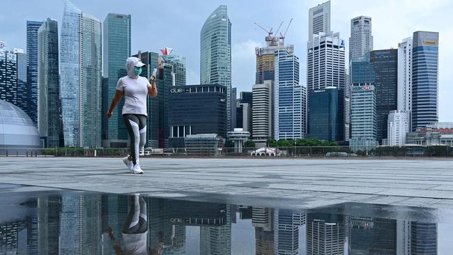 Singapore lifts Covid curbs as WHO pushes ‘pill’ for unvaxxed