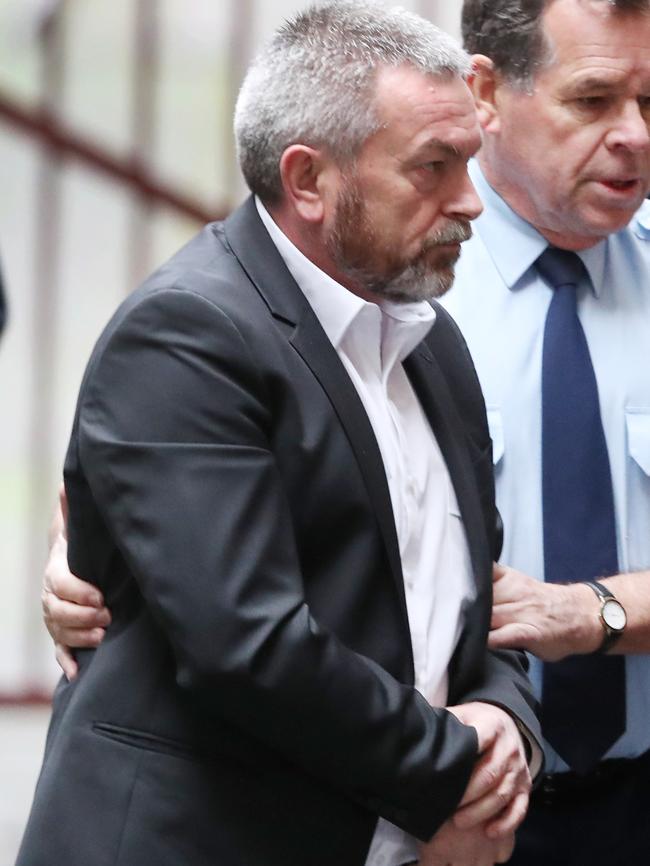 Borce Ristevski is led into court this morning. Picture: David Crosling