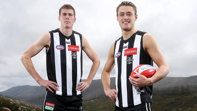 Darcy Moore and Mason Cox model Collingwood’s jumper with new emblem and apparel sponsors logo in Falls Creek. Picture: Michael Klein