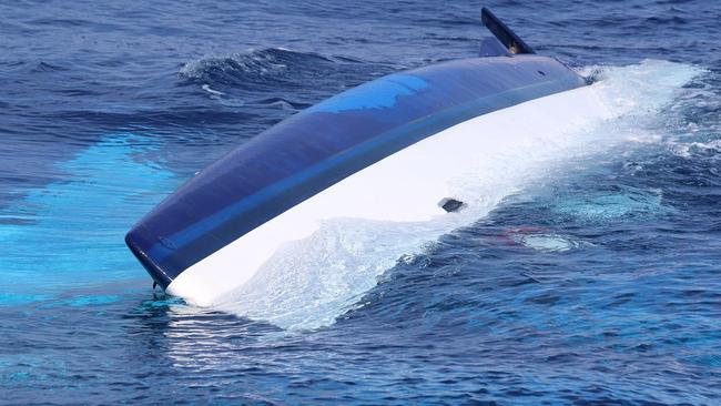 The 37-foot catamaran, Surf into Summer, partially sunk in the Florida Straits which authorities have since lost track of.